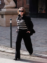 A woman wears jumpsuit-like outfit